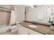 Bright bathroom featuring a shower-tub combination, granite counters, and a towel rack at 2146 Wolbert Trl, Marietta, GA 30062
