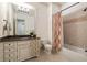 Classic bathroom with a large vanity, granite countertop, tile floors, and a shower-tub combination at 2146 Wolbert Trl, Marietta, GA 30062