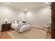 Cozy bedroom with wood floors, a comfortable bed, an armchair, and an antique armoire at 2146 Wolbert Trl, Marietta, GA 30062