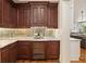 Elegant butler's pantry with custom cabinets, wine fridge, and marble countertops at 2146 Wolbert Trl, Marietta, GA 30062