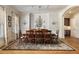 Formal dining room with large windows, elegant chandelier, and seating for eight at 2146 Wolbert Trl, Marietta, GA 30062
