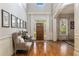 Inviting foyer with hardwood floors, high ceilings, natural light, and elegant decor at 2146 Wolbert Trl, Marietta, GA 30062