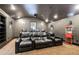 Home theater with reclining leather seating, projector, sconces, and a popcorn machine at 2146 Wolbert Trl, Marietta, GA 30062