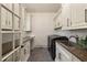 Well-organized laundry room with ample counter space, cabinetry, and modern appliances at 2146 Wolbert Trl, Marietta, GA 30062