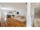 Open living area featuring hardwood floors, a seating area, a dining area, and a stairway at 2146 Wolbert Trl, Marietta, GA 30062