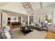 Open living space with high ceilings, hardwood floors, and a view into the kitchen at 2146 Wolbert Trl, Marietta, GA 30062