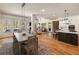 Open-concept living space featuring dining area, kitchen, and living room with hardwood floors at 2146 Wolbert Trl, Marietta, GA 30062