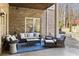 Relaxing outdoor patio with comfortable seating and a stylish blue rug, adjacent to the sparkling swimming pool at 2146 Wolbert Trl, Marietta, GA 30062