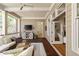 Relaxing covered porch with comfortable seating, ceiling fan, and wooded views at 2146 Wolbert Trl, Marietta, GA 30062