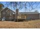 Exterior home with a backyard deck and lush green grass at 2920 Glenda Ct, Loganville, GA 30052