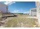 An outdoor back yard with healthy grass and a small patio at 7783 Hansel Ln, Lithonia, GA 30058