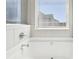 This bathroom has a soaking tub, tile flooring and large windows at 7783 Hansel Ln, Lithonia, GA 30058
