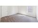 A bedroom featuring neutral walls, carpets and a window providing natural light at 7783 Hansel Ln, Lithonia, GA 30058