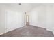 A bedroom featuring neutral walls, carpets and two closets at 7783 Hansel Ln, Lithonia, GA 30058