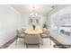 Chic staged dining room with stylish furnishings and a bright, airy ambiance at 7783 Hansel Ln, Lithonia, GA 30058
