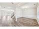 Spacious dining room featuring new laminate flooring, modern lighting, and ample natural light at 7783 Hansel Ln, Lithonia, GA 30058