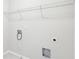 A laundry room featuring neutral walls with utility hook ups and wire shelving at 7783 Hansel Ln, Lithonia, GA 30058