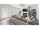 Bright, staged living room with fireplace, ceiling fan, and neutral colors at 7783 Hansel Ln, Lithonia, GA 30058