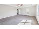 Bright carpeted primary bedroom with neutral paint and lots of natural light at 7783 Hansel Ln, Lithonia, GA 30058