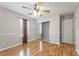 Cozy bedroom with hardwood floors and a spacious mirrored closet at 240 Village Square Dr, Woodstock, GA 30188