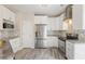 Well-equipped kitchen with white cabinets, stainless steel appliances, and granite countertops at 240 Village Square Dr, Woodstock, GA 30188