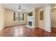 Inviting living room with a cozy fireplace, hardwood floors, and ample natural light at 240 Village Square Dr, Woodstock, GA 30188