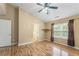 Spacious bedroom with vaulted ceilings, hardwood floors, and ample natural light at 240 Village Square Dr, Woodstock, GA 30188