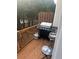 Outdoor patio area with grill, propane tank, and small bar-height table and stools at 240 Village Square Dr, Woodstock, GA 30188