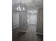 Hallway features gray walls, and wood-look flooring at 3201 Fairington Dr, Lithonia, GA 30038