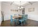 Bright dining room with a coffered ceiling, wood floors, and stylish décor at 388 Greighmoor Ct, Loganville, GA 30052