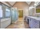 Bright bathroom with walk-in shower, soaking tub, double vanity with gray cabinets, and granite countertops at 596 Whitby Dr, Douglasville, GA 30134