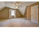 Spacious bedroom with neutral carpet, tan walls, ceiling fan and natural light from a window at 596 Whitby Dr, Douglasville, GA 30134