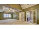 Large main bedroom features vaulted ceiling, ceiling fan, and ensuite bathroom with double doors at 596 Whitby Dr, Douglasville, GA 30134