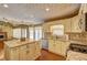 Open-concept kitchen with island, hardwood floors, stainless steel appliances, and ample counter space at 596 Whitby Dr, Douglasville, GA 30134