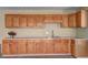 Kitchen area features light-colored wood cabinetry, countertop space and a double sink at 596 Whitby Dr, Douglasville, GA 30134