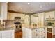 Well-appointed kitchen featuring granite countertops, stainless steel appliances, and custom cabinetry at 596 Whitby Dr, Douglasville, GA 30134