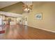Open-concept living area with hardwood flooring, vaulted ceilings, and seamless kitchen access at 596 Whitby Dr, Douglasville, GA 30134