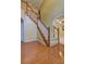 A naturally lit staircase with hardwood floors leads to the upper level of this home at 596 Whitby Dr, Douglasville, GA 30134