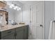 Bathroom with a modern single vanity, stone countertop, modern faucet, and neutral wall paint at 1870 Shoreline Trce, Grayson, GA 30017
