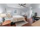 Bedroom featuring hardwood floors, natural light, and a bright aesthetic at 1870 Shoreline Trce, Grayson, GA 30017
