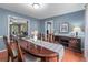 Lovely dining room with wood table, seating for six, wood floors, and plenty of natural light at 1870 Shoreline Trce, Grayson, GA 30017
