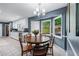Charming eat-in kitchen with a round table, natural light, and a view of the backyard at 1870 Shoreline Trce, Grayson, GA 30017