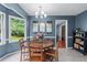Cozy eat-in kitchen featuring a breakfast table and ample natural light from a large window at 1870 Shoreline Trce, Grayson, GA 30017