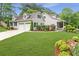 Stylish home featuring an attached garage and beautifully landscaped front yard at 1870 Shoreline Trce, Grayson, GA 30017