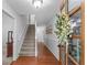Welcoming foyer with hardwood floors and staircase, creating a grand entrance at 1870 Shoreline Trce, Grayson, GA 30017