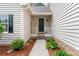 Charming front porch with well-maintained landscaping creating inviting curb appeal at 1870 Shoreline Trce, Grayson, GA 30017