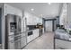 Bright kitchen with white cabinets, stainless steel appliances, and plenty of countertop space at 1870 Shoreline Trce, Grayson, GA 30017