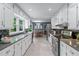 Spacious kitchen with updated appliances and white cabinetry offering ample storage at 1870 Shoreline Trce, Grayson, GA 30017