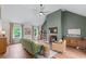 Bright living room with vaulted ceilings, hardwood floors, and a modern fireplace at 1870 Shoreline Trce, Grayson, GA 30017