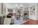 Cozy living room featuring a stone fireplace and built-in bookshelves at 1870 Shoreline Trce, Grayson, GA 30017